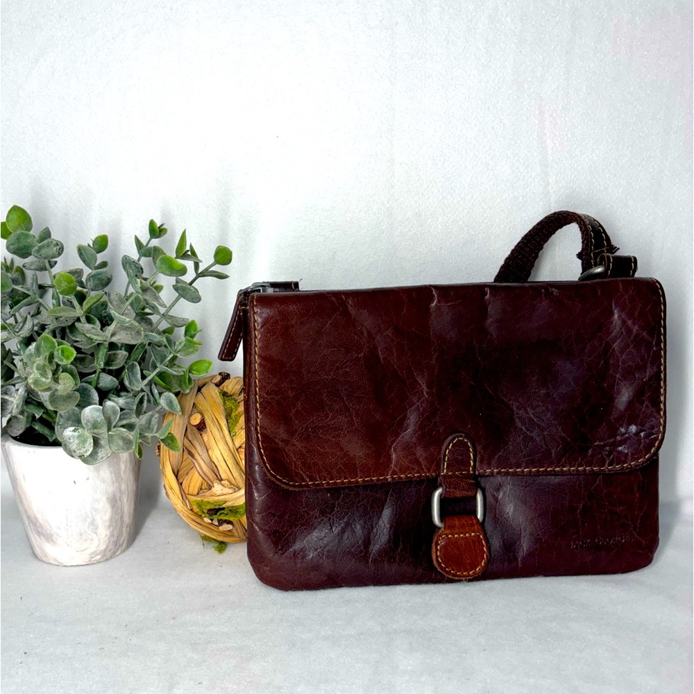 Jack George’s brown leather bag. So many storage compartments and in great shape